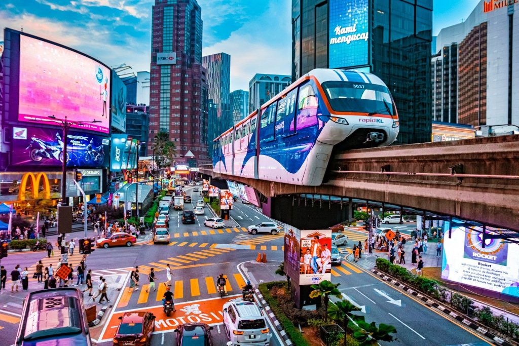 a city street filled with traffic and tall buildings